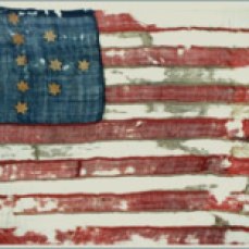 The "Hulbert Flag'" which may have flown over Ft. Ticonderoga during the Jersey Grey's encampment there. This particular flag was likely the first model for the American "Stars and Stripes."